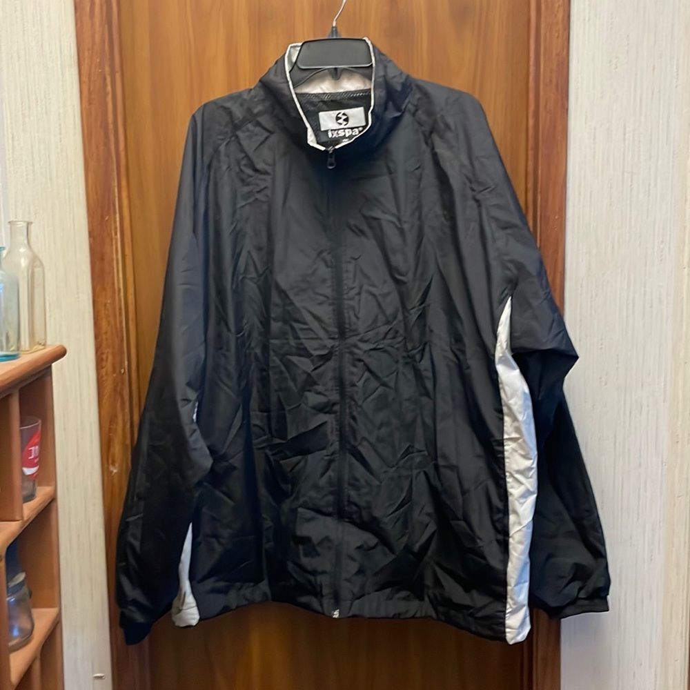 Men's IXSPA black and cream colored lightweight jacket. Size XXL